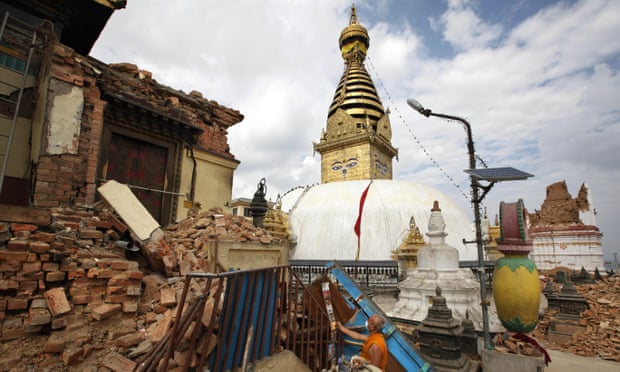 A Buddhist monk salvages religious items from a monastery around the famous Swayambhunath stupa after it was damaged by Saturday’s earthquake.