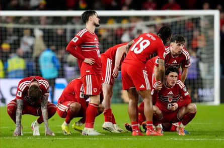 Harry Wilson (right) and his Wales teammates react after the penalty shootout loss by Bosnia and Herzegovina.
