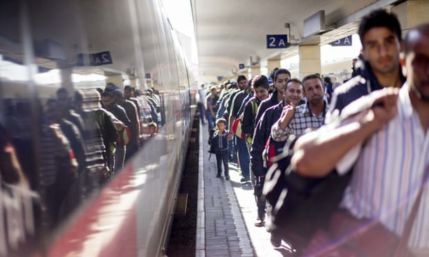Refugees at Vienna’s Westbahnhof train station, after arriving by train from Hungary