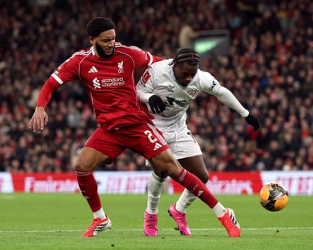 Joe Gomez vying for the ball with Barnsley’s Reyes Cleary
