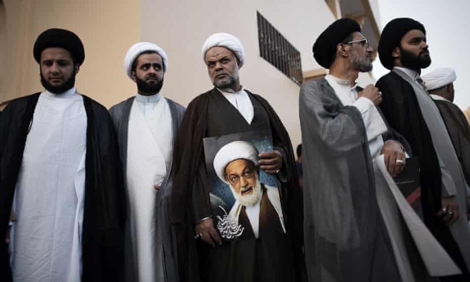 Bahraini Shiite clerics attend a protest against the revocation of the citizenship of top Bahraini Shiite cleric Sheikh Isa Qassim (portrait), on June 20, 2016 near Qassim’s house in the village of Diraz, west of Manama. Bahrain said it has revoked the citizenship of the Sunni-ruled kingdom’s top Shiite cleric, accusing him of sowing sectarian divisions, in a move that sparked protests among the majority community. / AFP PHOTO / MOHAMMED AL-SHAIKHMOHAMMED AL-SHAIKH/AFP/Getty Images