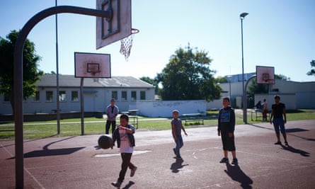 Children play basketball at Patrick Henry Village refugee centre in 2015.