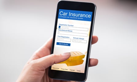 A woman looks at a car insurance form on her phone