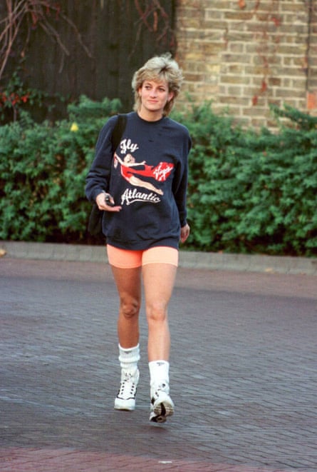 Diana wearing a baggy navy sweatshirt with ‘Fly Atlantic’ logo, peach stretch shorts and white ankle socks and trainers