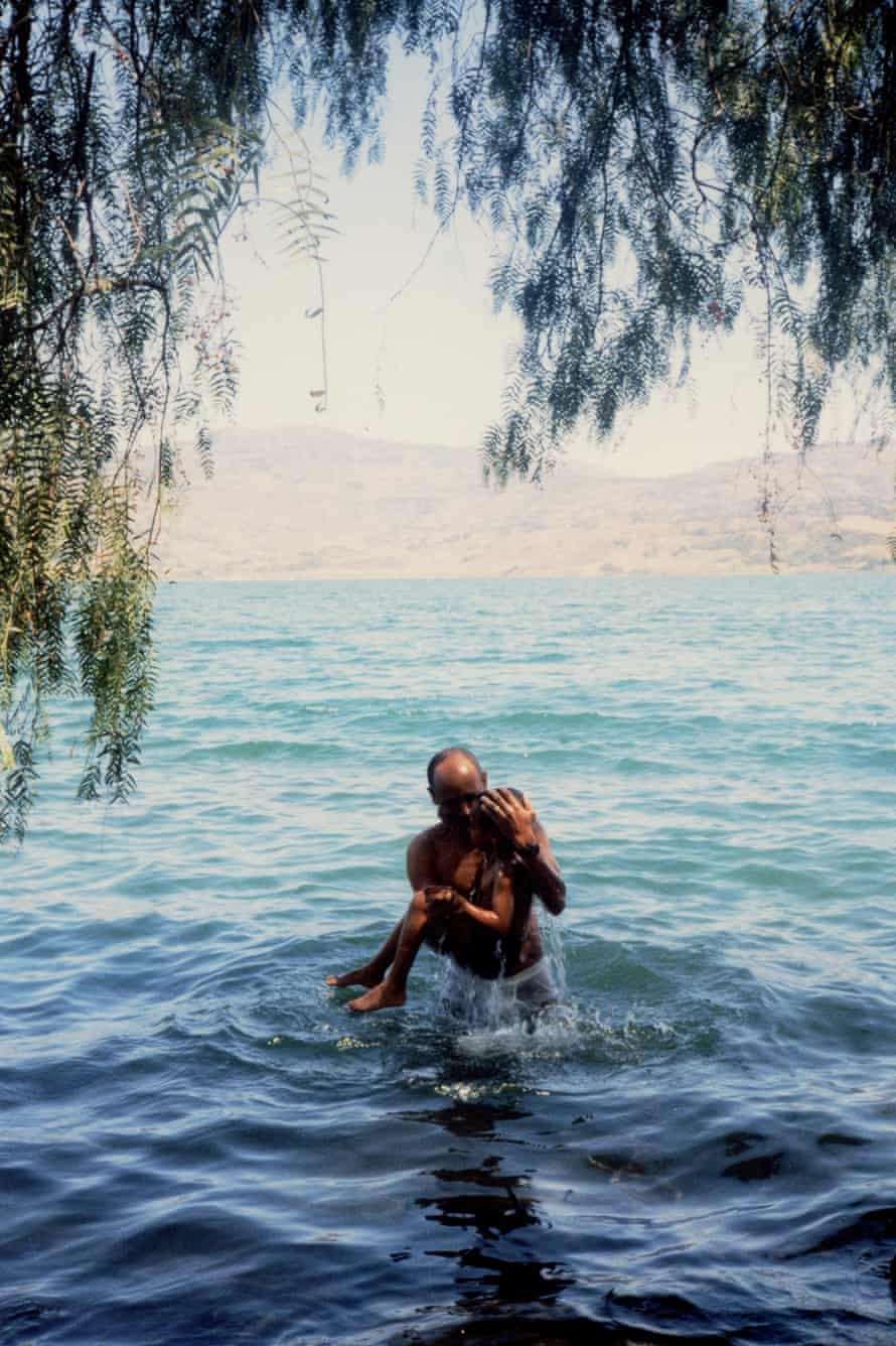 My father, carrying me out of the water. (Ethiopia)