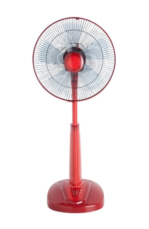 a red electric fan on a tall base