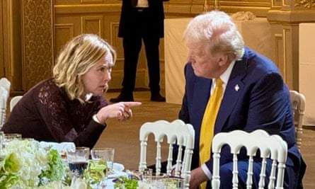 Meloni and Trump talking at a dinner table