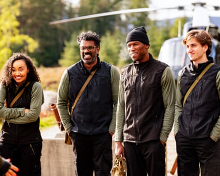 Leigh-Anne Pinnock, Romesh Ranganathan and others smile outdoors near a helicopter