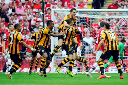 Hull City’s James Chester (C) celebrates with his teammates after scoring the opening goal during the FA Cup final against Arsenal in 2014