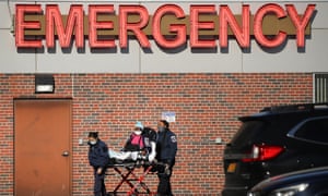 Medical workers tend to a patient at a Brooklyn hospital that has seen a rise in coronavirus-related cases on Tuesday in New York City.