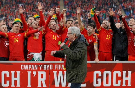 Dafydd Iwan singing Yma o Hyd along with the victorious Wales squad after the World Cup playoff final match between Wales and Ukraine at Cardiff City Stadium on 5 June.