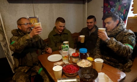 Soldiers from the 80th Separate Air Assault Brigade celebrate with a toast over Orthodox Christmas at dinner from the frontline region of Kreminna, Ukraine.