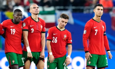Portugal look crestfallen after defeat on penalties.