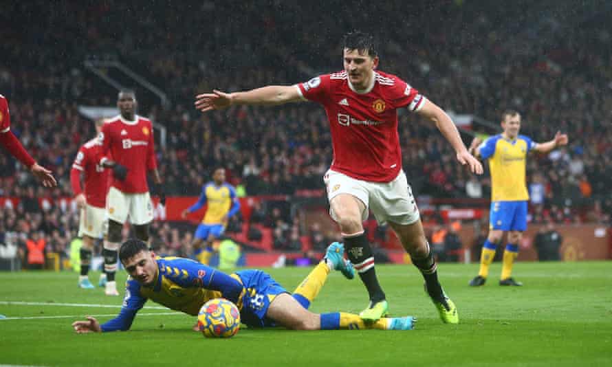 Harry Maguire of Manchester United stands on the leg of Southampton’s Armando Broja.