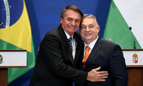 Jair Bolsonaro, then president of Brazil, hugs Hungary's prime minister, Viktor Orbán, right, at a joint press conference in Budapest in 2022.