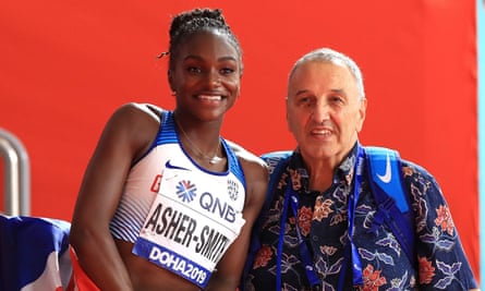 Dina Asher-Smith with her coach John Blackie after winning the 200m final at the 2019 World Athletics Championships in Doha, Qatar.