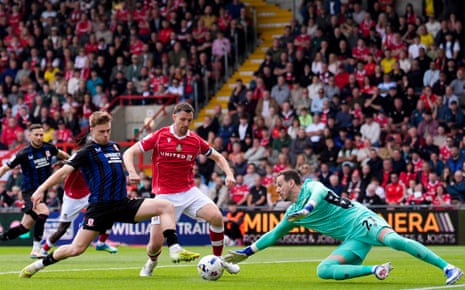 Middlesbrough’s Tommy Conway (left) scoring the opening goal at Wrexham.