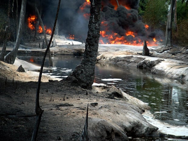 Oil from a leaking pipeline burns in Goi-Bodo, a swamp area of the Niger delta, in 2004
