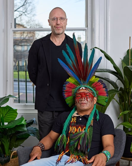 Dr Justin Dwyer and Muka Yawanawa who's wearing a feather headdress