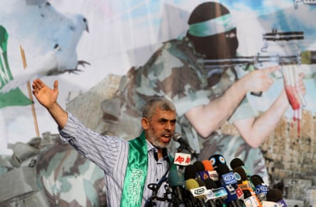 He has Hamas livery around his neck and talks into microphones