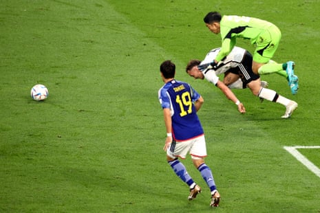 David Raum of Germany is fouled by Shuichi Gonda of Japan, resulting in a penalty.