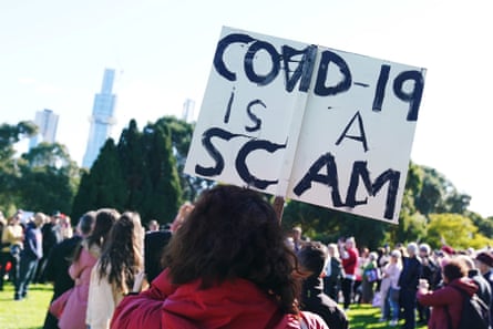 Conspiracy theorists protest against vaccinations and 5G at the Botanical Gardens in Melbourne