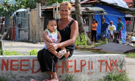 Grandmother with grandchild in the fishing village of San Dionisio devastated by typhoon Haiyan/Yolanda