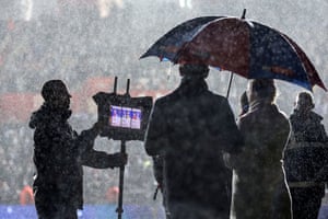 Sky Sports’ Kelly Cates and Gary Neville find some shelter at St Mary’s Stadium. Sky is bracing for a consumer-led recession.