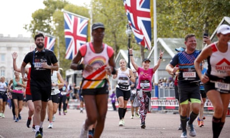 Runners approach the finish line of the London marathon on the Mall.