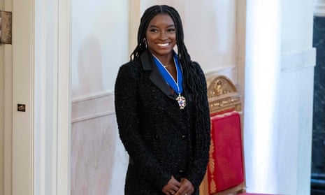 Simone Biles looks on after receiving the Presidential Medal of Freedom, the nation's highest civilian honor.