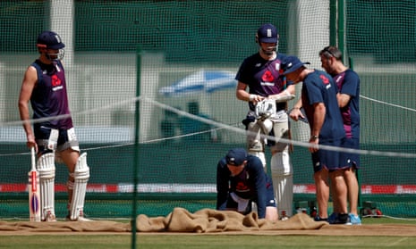 England players inspect the pitch during a practice session in Ahmedabad.