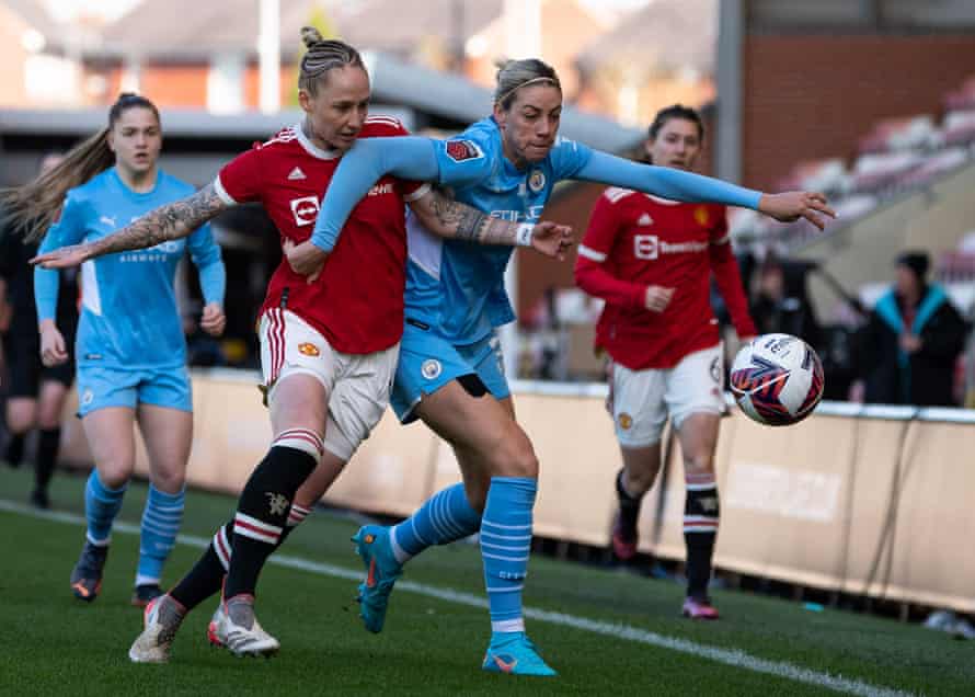 Manchester United's Leah Galton (left) and Manchester City's Alanna Kennedy battle for the ball.