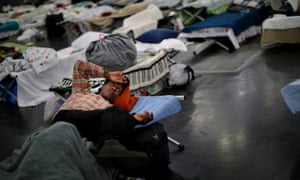 Evacuees of the powerful storm are taking shelter across the city, including here at the George R Brown Convention Center in downtown Houston.