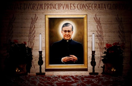 A painting of a priest with a halo around his head behind an altar