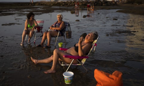 Sun, sand, saints and sharks: the best summer photographs