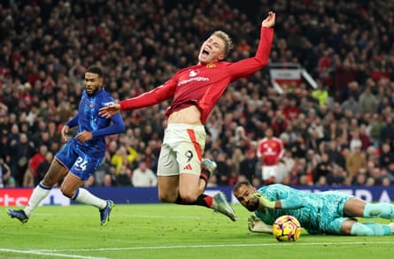 Rasmus Hojlund of Manchester United is fouled by Robert Sanchez of Chelsea resulting in a penalty at Old Trafford