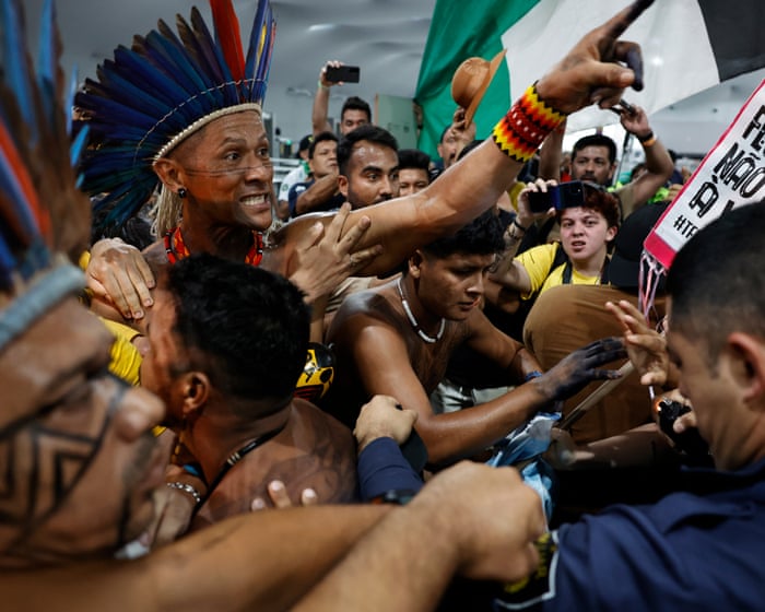 Protesters force their way into Cop30 climate summit – video
