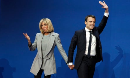Emmanuel Macron celebrates with wife, Brigitte Trogneux, after the first round