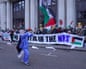 NHS workers display a protest banner outside the headquarters of Palantir