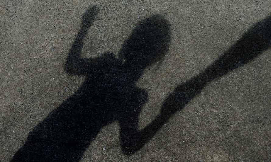 Shadow of child holding adult's hand