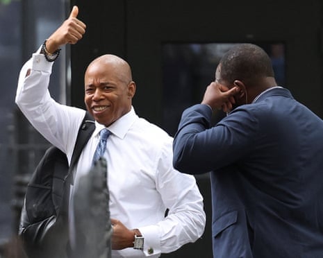Eric Adams smiling and giving thumbs up