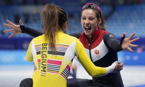 Suzanne Schulting, right, of the Netherlands, embraces Hanne Desmet of Belgium.