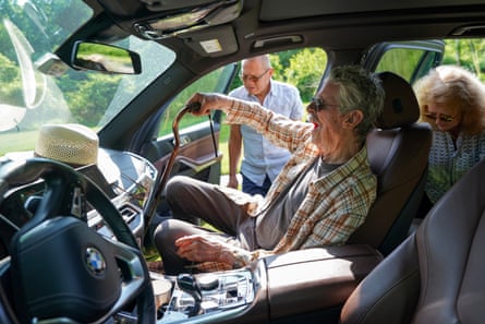 a man sits in a car