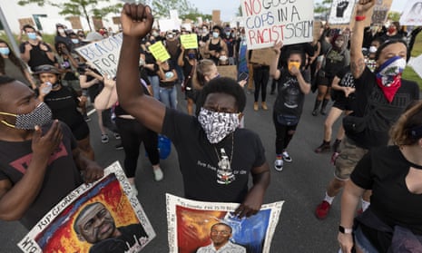 Demonstrators march during a protest against police brutality, at the University of Massachusetts in Boston, 6 June