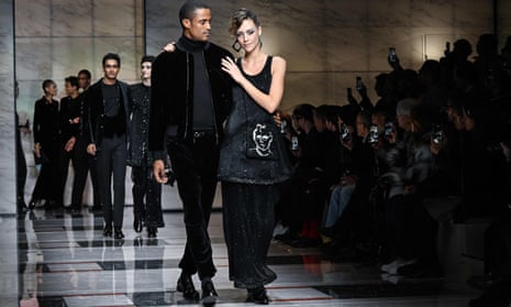Models present a creation of Giorgio Armani during Milan fashion week
