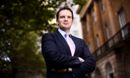 Photographic portrait of Dan Poulter in a suit and tie