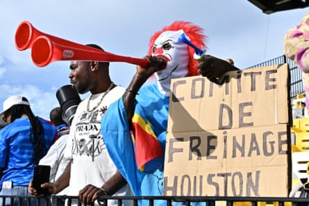 A fan cheers as DRC players take to the pitch for training at Sabercats Stadium