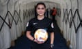 Sophie Dennington holds a football on refereeing duty