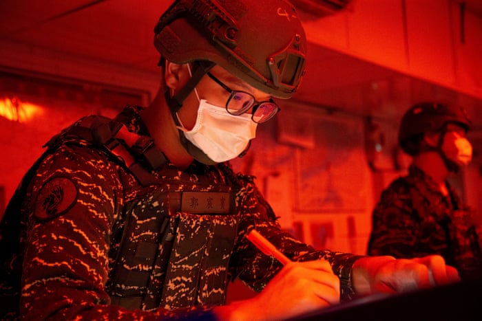 A Taiwan Navy soldier monitors Chinese activity at an undisclosed location in this image released on 7 August.