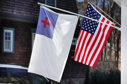 A christian flag waving next to the American flag